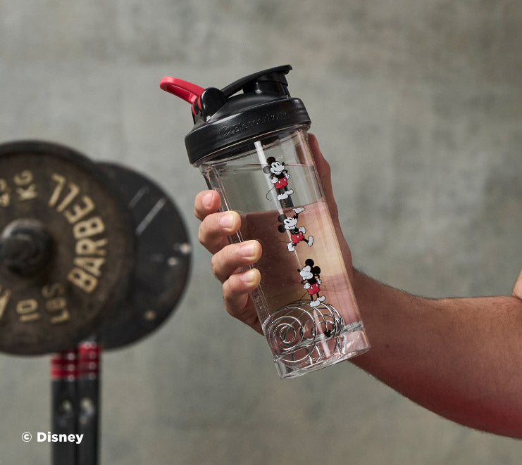 pro-series-e5 Mickey_Mouse_Protein_Shaker_Bottle_Being_Held_In_the_Gym.jpg